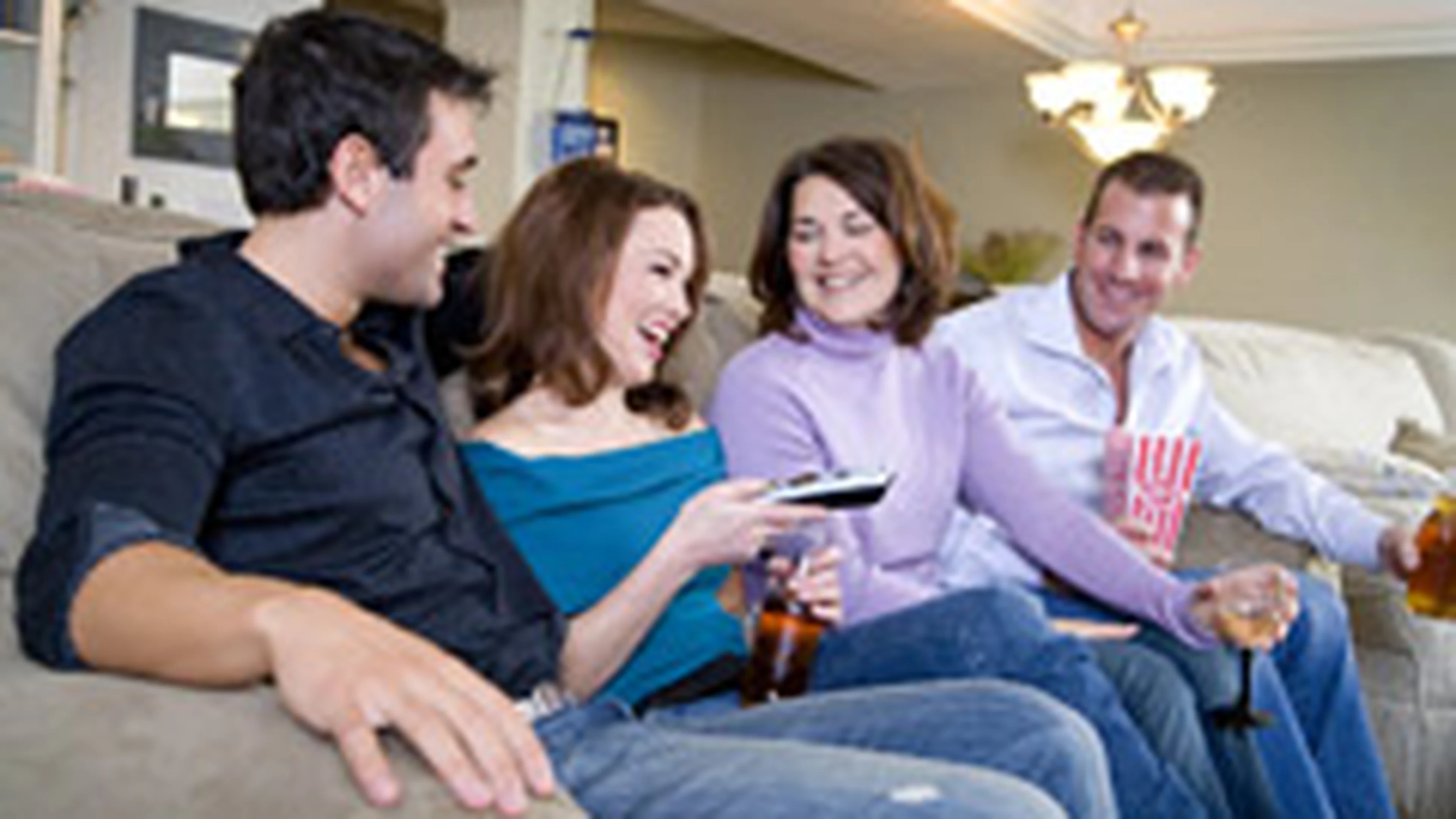 Family and friends enjoying home entertainment together