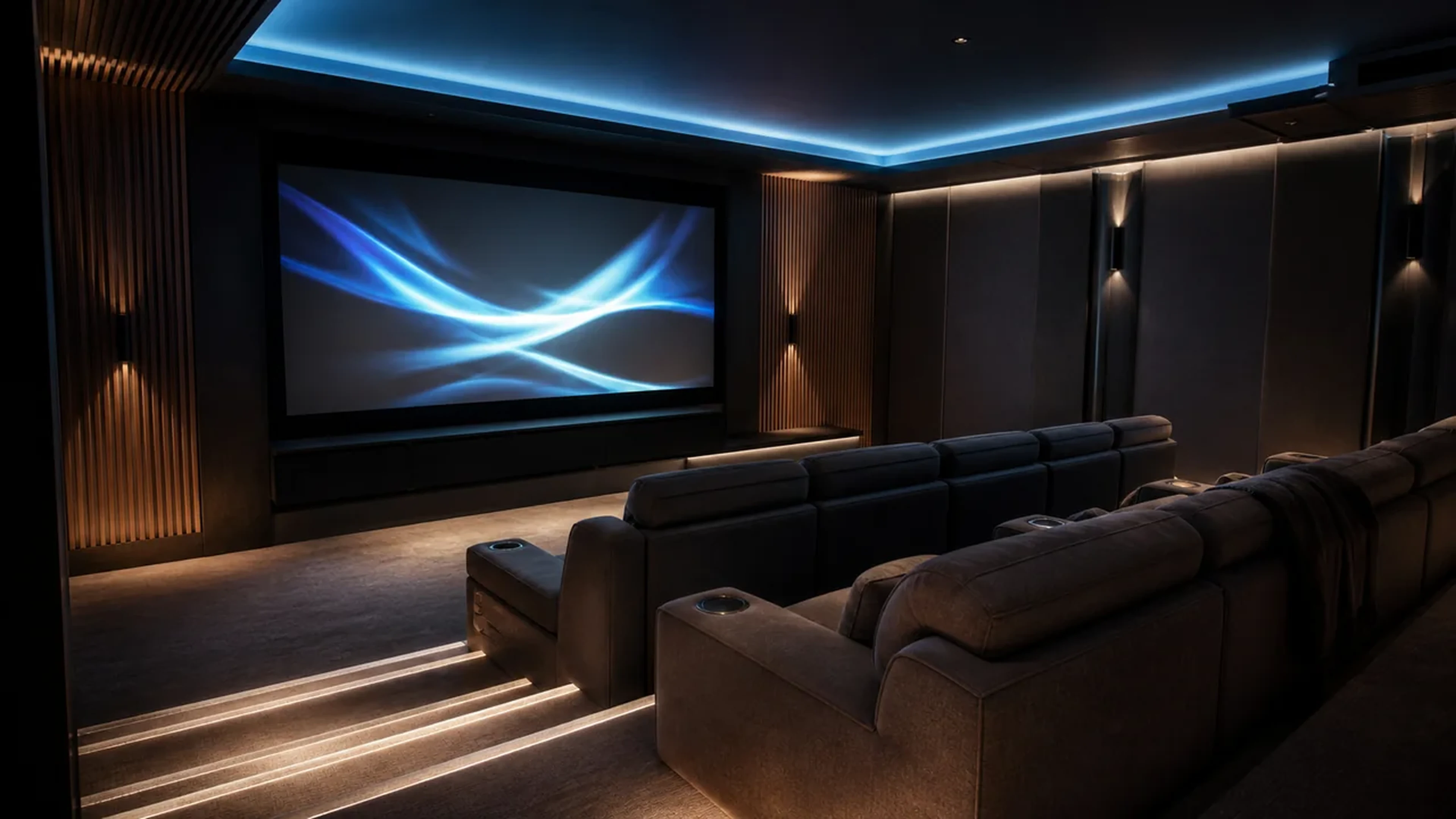 Custom home cinema with a projection screen, acoustic treatments, and comfortable seating